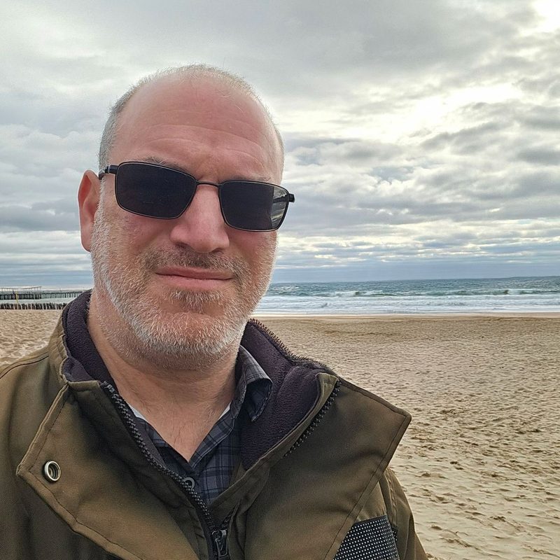 Matthew Schuller on a beach on Long Island
