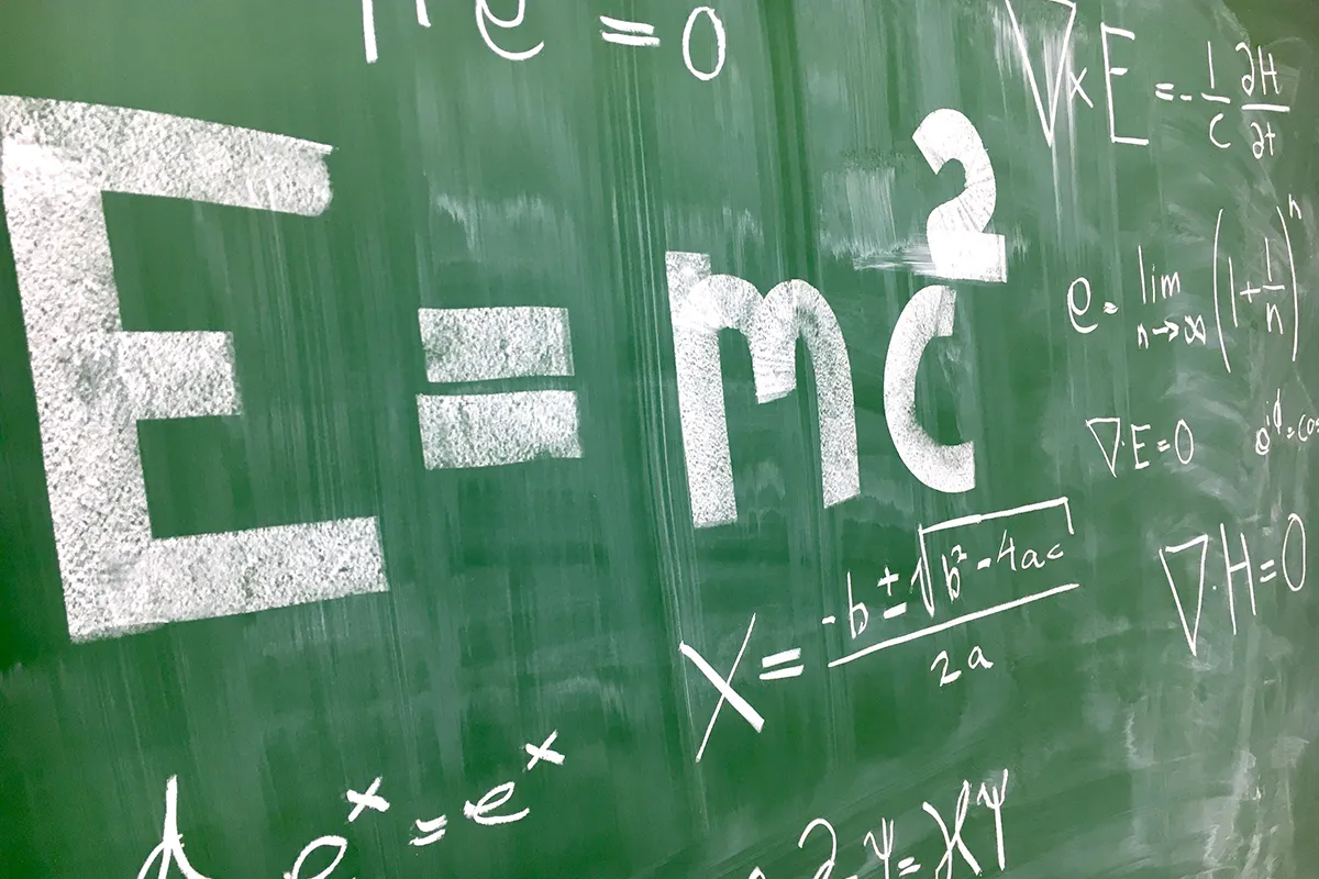 A blackboard covered in physics equations